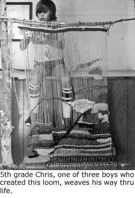 elementary school boy weaving on a hand loom