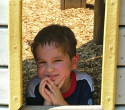 Jack looking through barnyard playhouse window